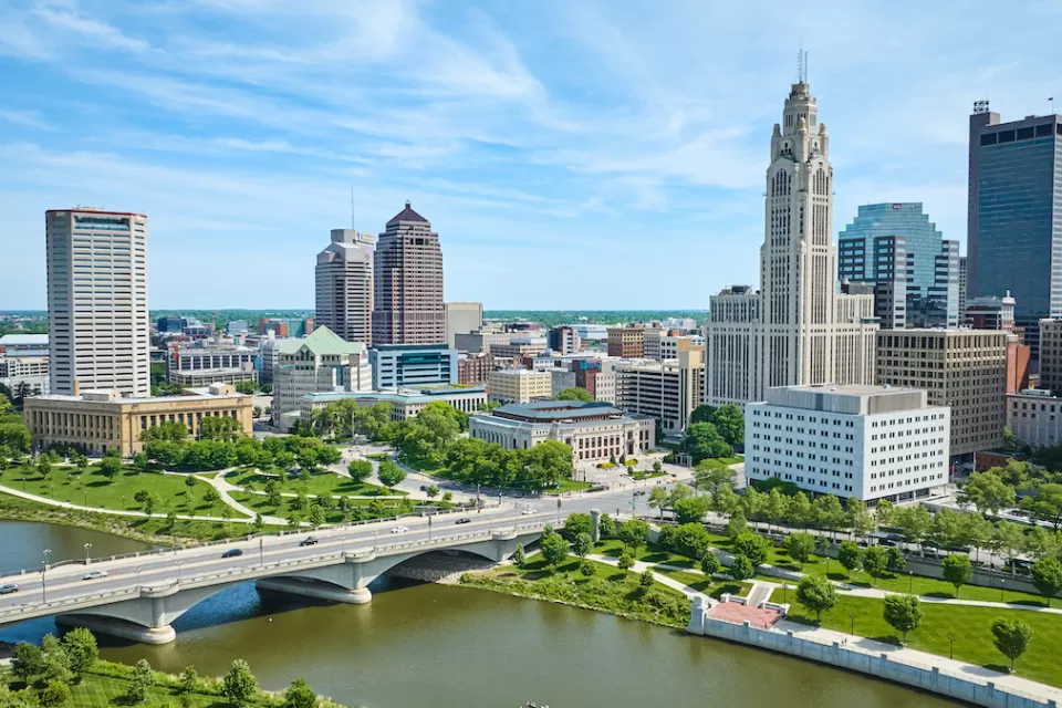 Aerial view of Columbus, Ohio skyline with river in foreground